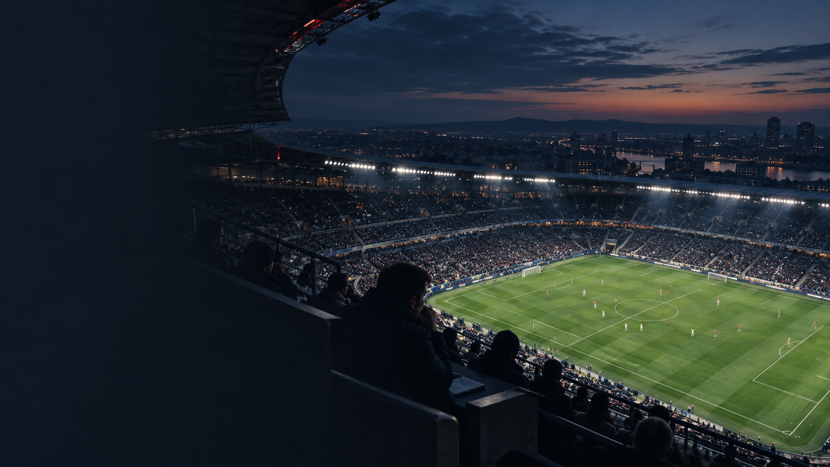 Estadio de fútbol al anochecer visto desde las gradas
